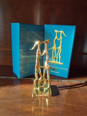 Vitlycke - Tin. The Wedding couple is a stone carving from the Swedish village.